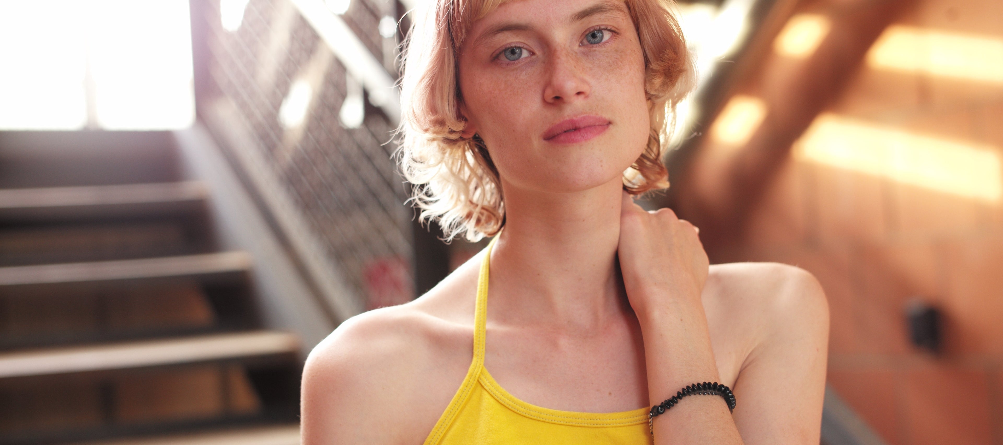 Model with black bracelet staircase